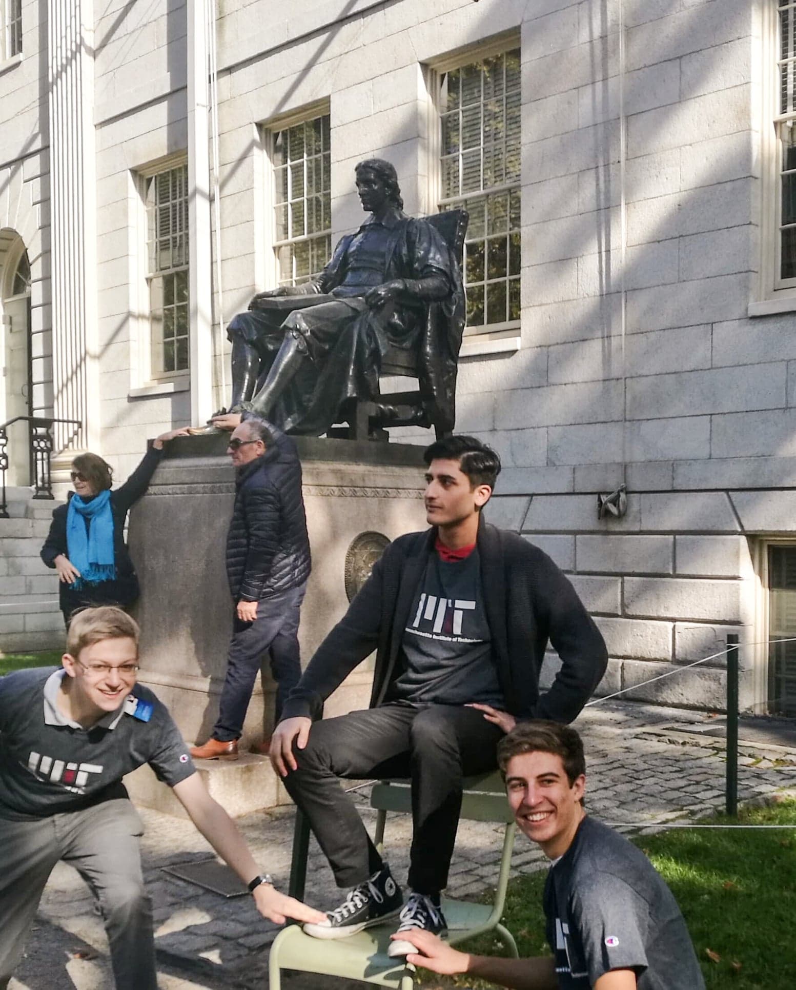 My friends and I at the statue of John Harvard, subverting the usual tradition